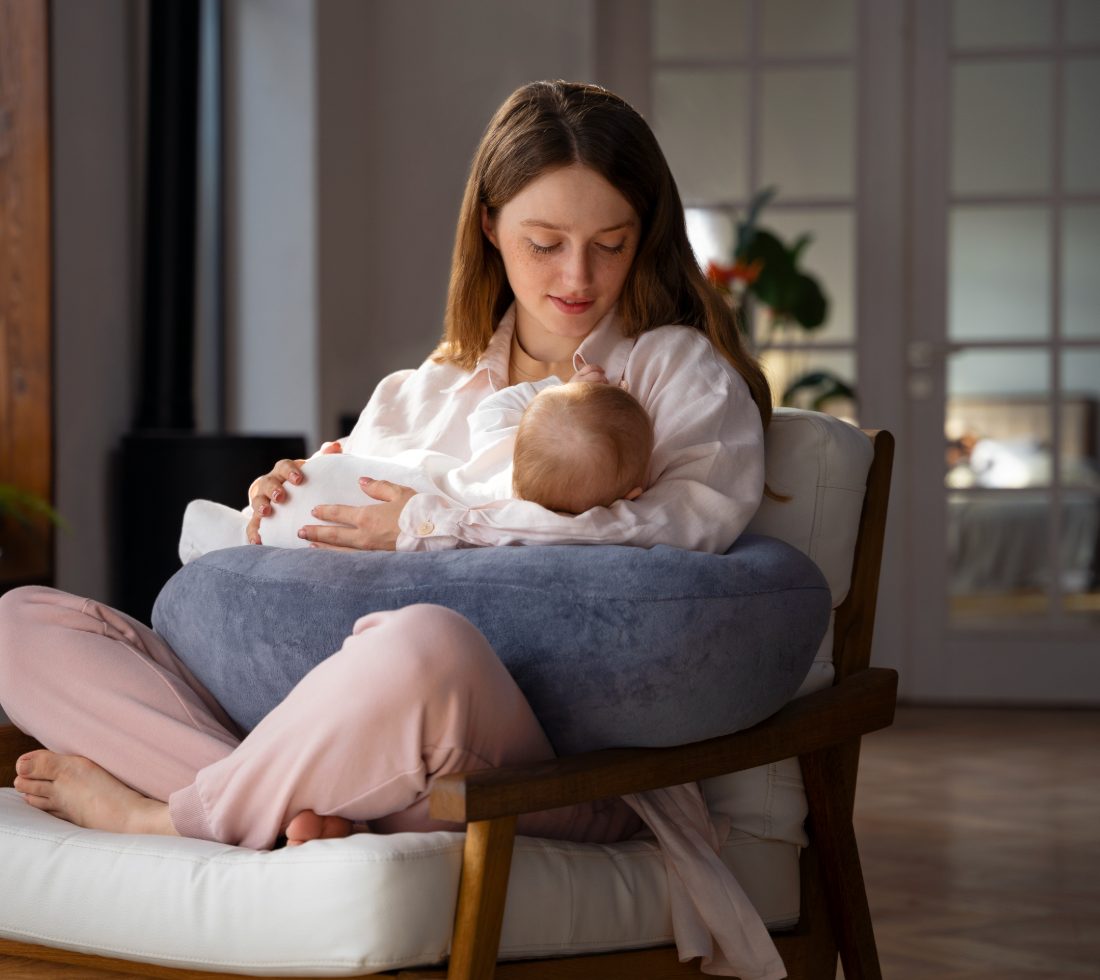 A mother feeding her newborn at home